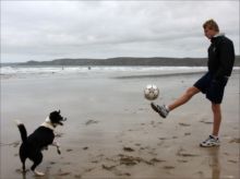 Footballing Dog on Newgale beach by Chris